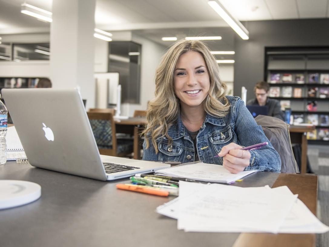 Student studying her class notes.